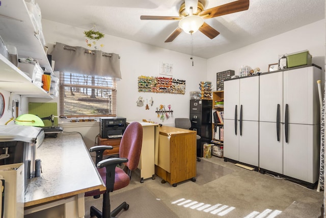 home office featuring a textured ceiling and a ceiling fan