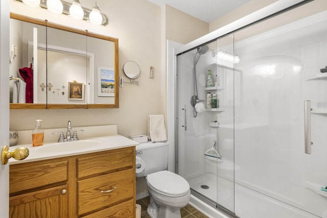 full bathroom with a shower stall, toilet, and vanity