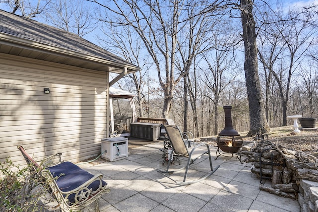 view of patio / terrace with a fire pit