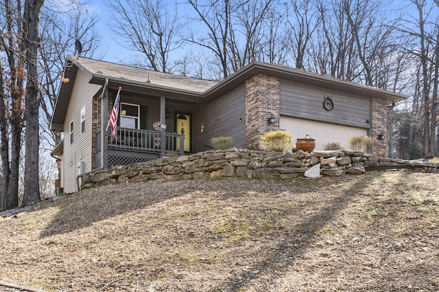 view of front of home with a garage and covered porch