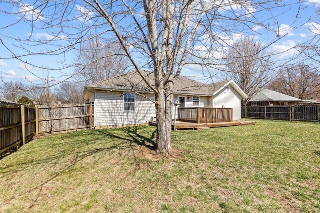 view of yard featuring a deck and a fenced backyard