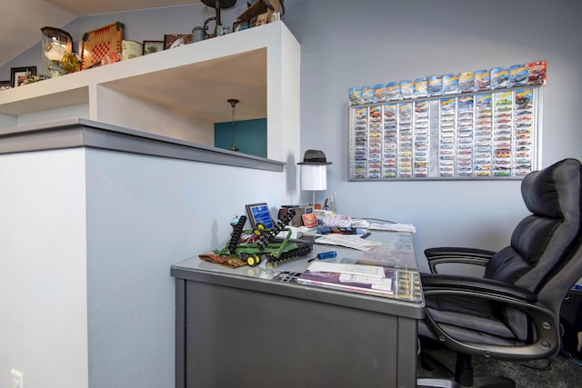 home office with lofted ceiling