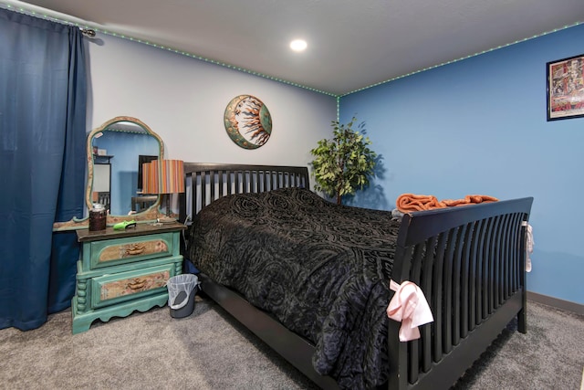 bedroom with baseboards and carpet floors