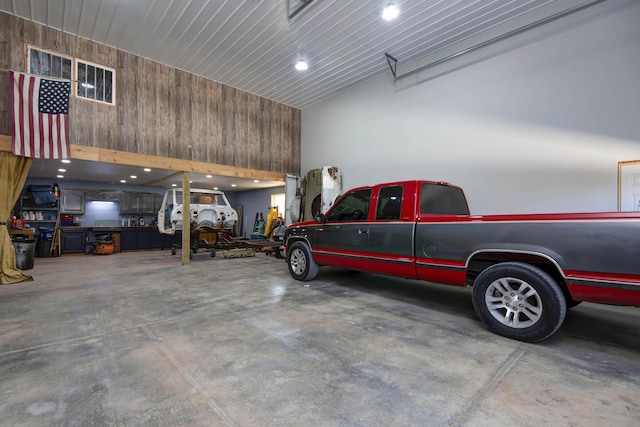 garage featuring wood walls