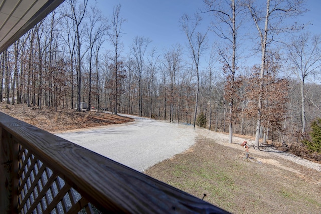 view of yard featuring a forest view