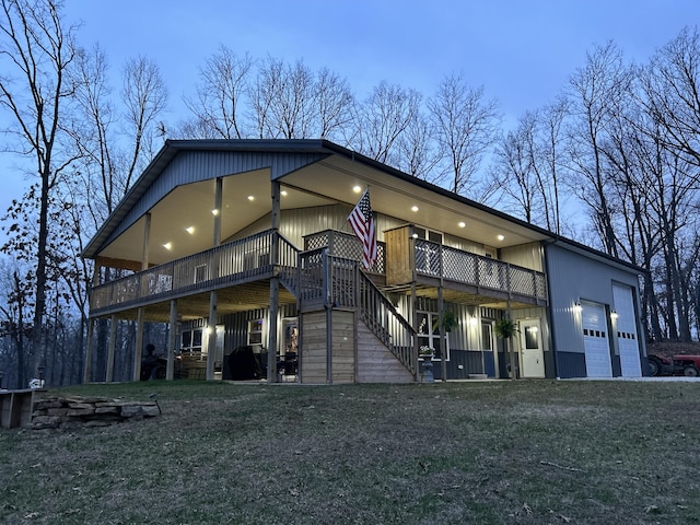 back of property with stairway and a deck