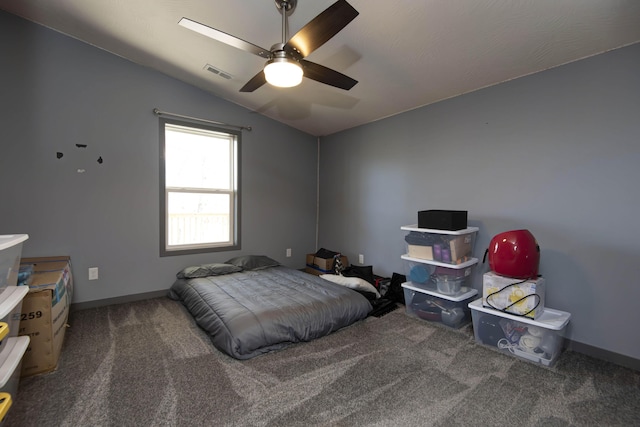 carpeted bedroom featuring visible vents, ceiling fan, baseboards, and lofted ceiling