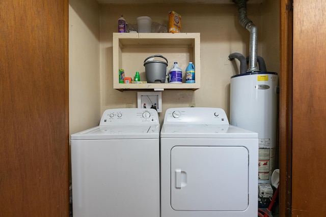 laundry area with water heater, laundry area, and separate washer and dryer