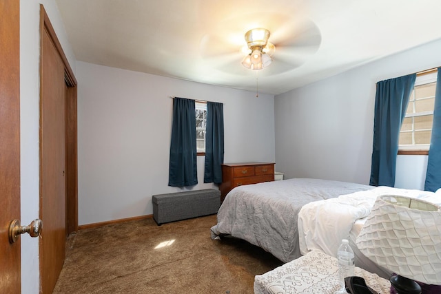 bedroom with baseboards, a ceiling fan, and carpet flooring