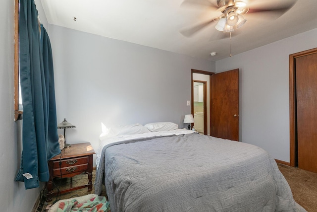 carpeted bedroom with baseboards and ceiling fan