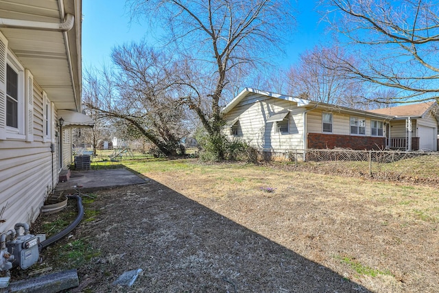 view of yard featuring a patio and fence