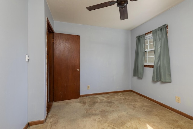 unfurnished bedroom featuring carpet, baseboards, and ceiling fan