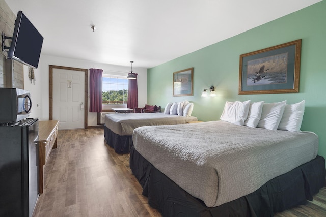 bedroom featuring wood finished floors