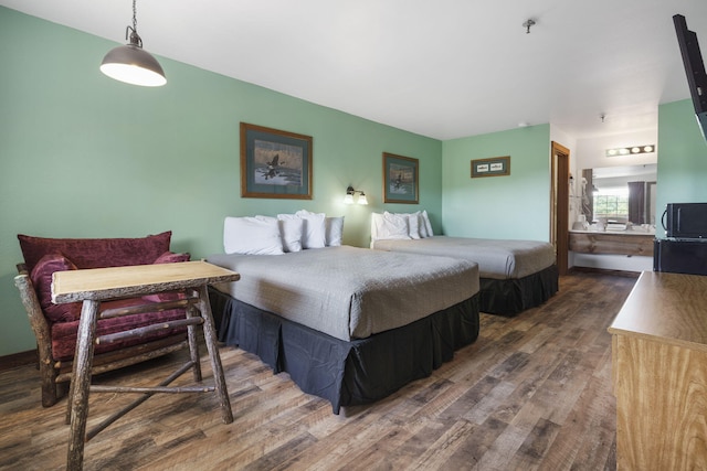 bedroom with wood finished floors