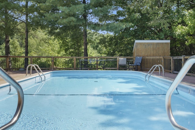 view of swimming pool featuring a deck