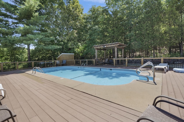 community pool featuring a deck and a pergola