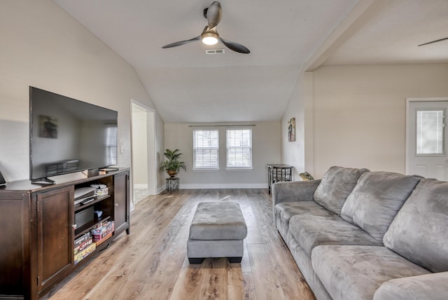 living room featuring a ceiling fan, visible vents, baseboards, lofted ceiling, and light wood-style floors