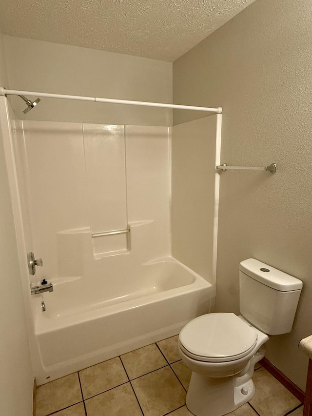 full bathroom featuring tile patterned flooring, shower / tub combination, toilet, and a textured ceiling