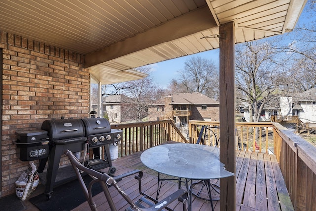 wooden terrace featuring outdoor dining space