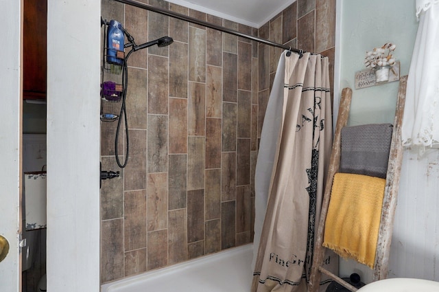 full bath with a shower stall and crown molding