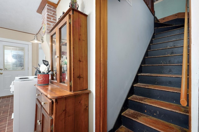 stairs featuring brick floor