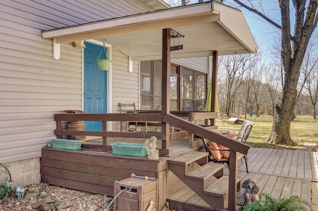 wooden terrace featuring a sunroom