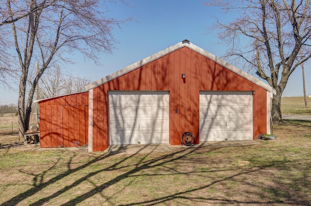 view of outbuilding featuring an outdoor structure and driveway