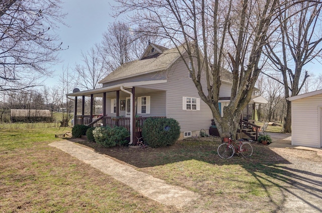 view of front of property with a porch and a front yard