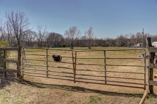 view of gate featuring a rural view