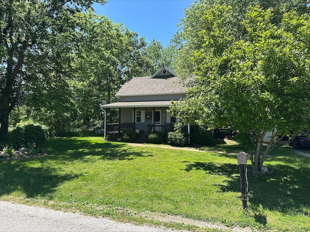13461 Lawrence Unit 1090, Mount Vernon, MO 65712 - view of front of house featuring covered porch, a front yard, and a shingled roof