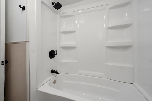 full bath featuring wainscoting