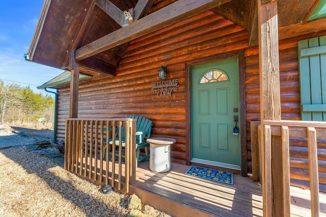 property entrance with log veneer siding