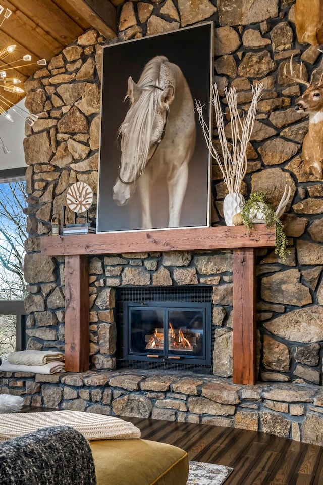 interior details with wood finished floors and a fireplace