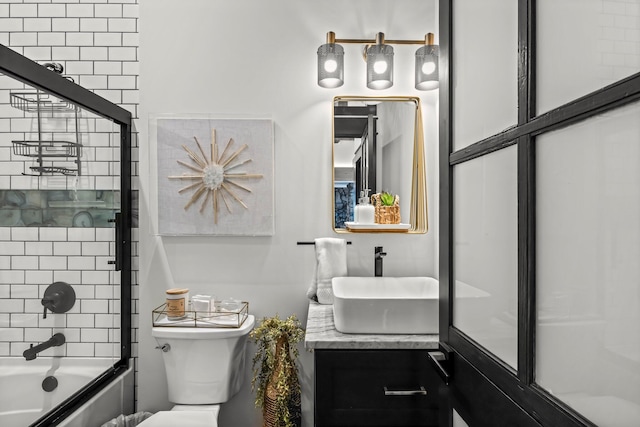 full bathroom featuring toilet, vanity, and bathtub / shower combination