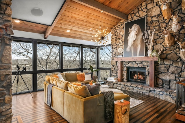 living area with wood finished floors, an inviting chandelier, lofted ceiling with beams, a fireplace, and wood ceiling