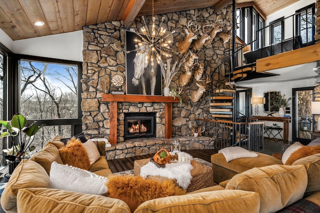 living area with high vaulted ceiling, a fireplace, stairs, wooden ceiling, and a notable chandelier