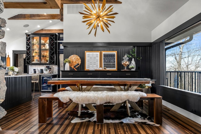 interior space featuring recessed lighting, wine cooler, hardwood / wood-style floors, and vaulted ceiling