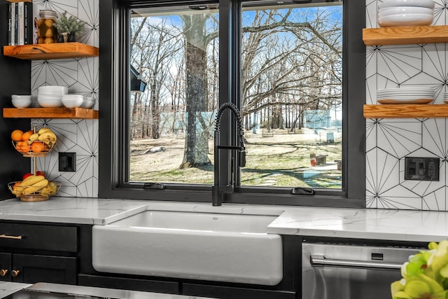 room details with open shelves, light stone countertops, and backsplash