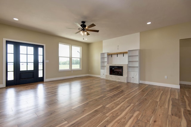 1883 S Farm Rd Unit 107, Springfield, MO 65802 - unfurnished living room with a ceiling fan, wood finished floors, baseboards, recessed lighting, and a tile fireplace