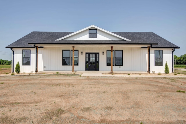 1883 S Farm Rd Unit 107, Springfield, MO 65802 - modern farmhouse style home featuring covered porch and a shingled roof