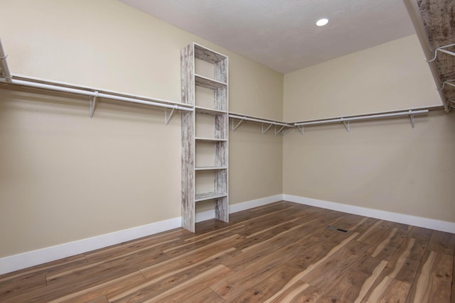 1883 S Farm Rd Unit 107, Springfield, MO 65802 - walk in closet featuring wood finished floors