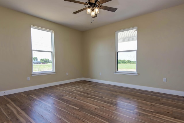 1883 S Farm Rd Unit 107, Springfield, MO 65802 - unfurnished room with healthy amount of natural light, dark wood finished floors, and baseboards