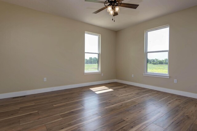 1883 S Farm Rd Unit 107, Springfield, MO 65802 - empty room with baseboards, ceiling fan, and wood finished floors
