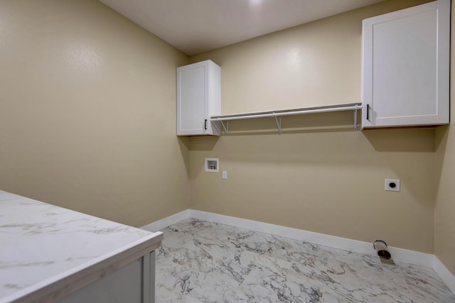 1883 S Farm Rd Unit 107, Springfield, MO 65802 - laundry room with hookup for an electric dryer, cabinet space, hookup for a washing machine, baseboards, and light marble finish floors