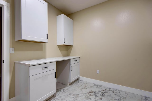 1883 S Farm Rd Unit 107, Springfield, MO 65802 - unfurnished office with light marble finish flooring and baseboards