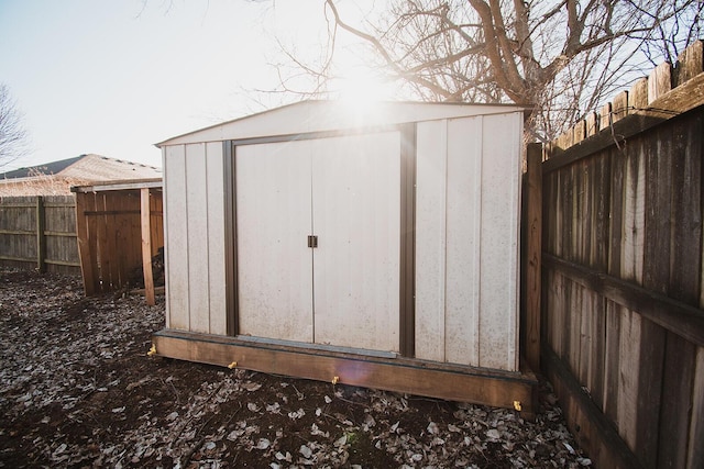 view of shed featuring a fenced backyard