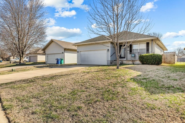 ranch-style house with a front lawn, fence, concrete driveway, covered porch, and a garage