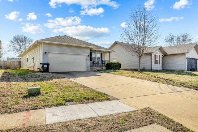 ranch-style home featuring a front yard, fence, a garage, and driveway