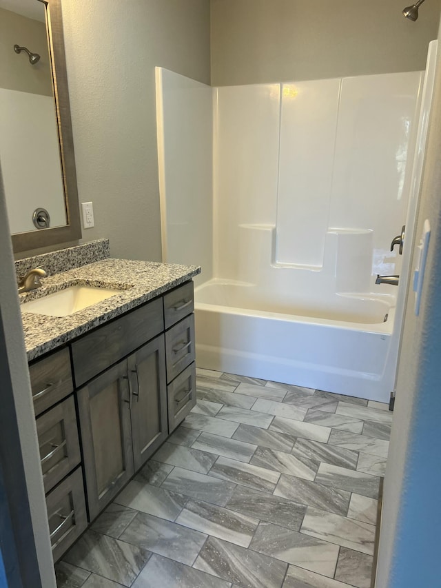 full bath featuring vanity and shower / bathtub combination