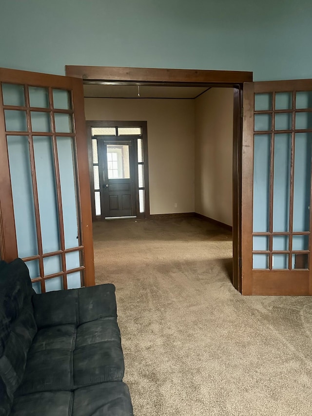 unfurnished living room with carpet floors